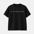 Veltino oversized black 240 GSM cotton terry t-shirt, front view with white text across the chest reading “Fear cuts deeper than swords”