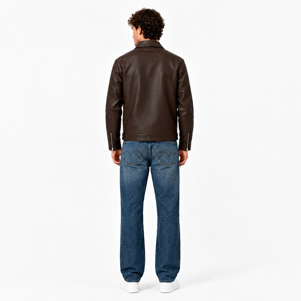Male model wearing the Veltino unisex brown leather jacket with a white tee