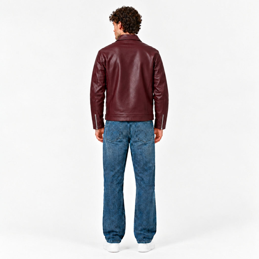 Male model wearing the Veltino unisex burgundy leather jacket with a black tee