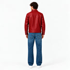 Male model wearing the Veltino unisex red vegan leather jacket with a black tee